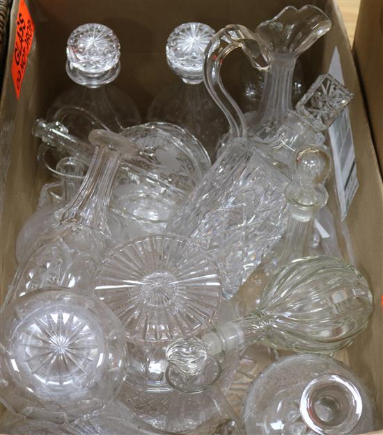 A collection of mixed cut glass decanters